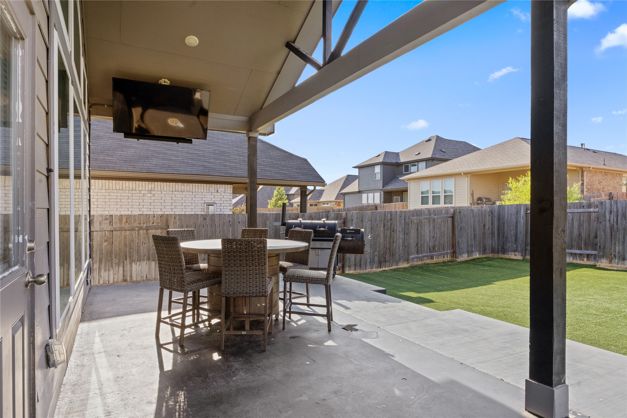 241 Oleander Loop Buda, TX 78610 - Photo 27 of 33 a view of a patio with a table and chairs