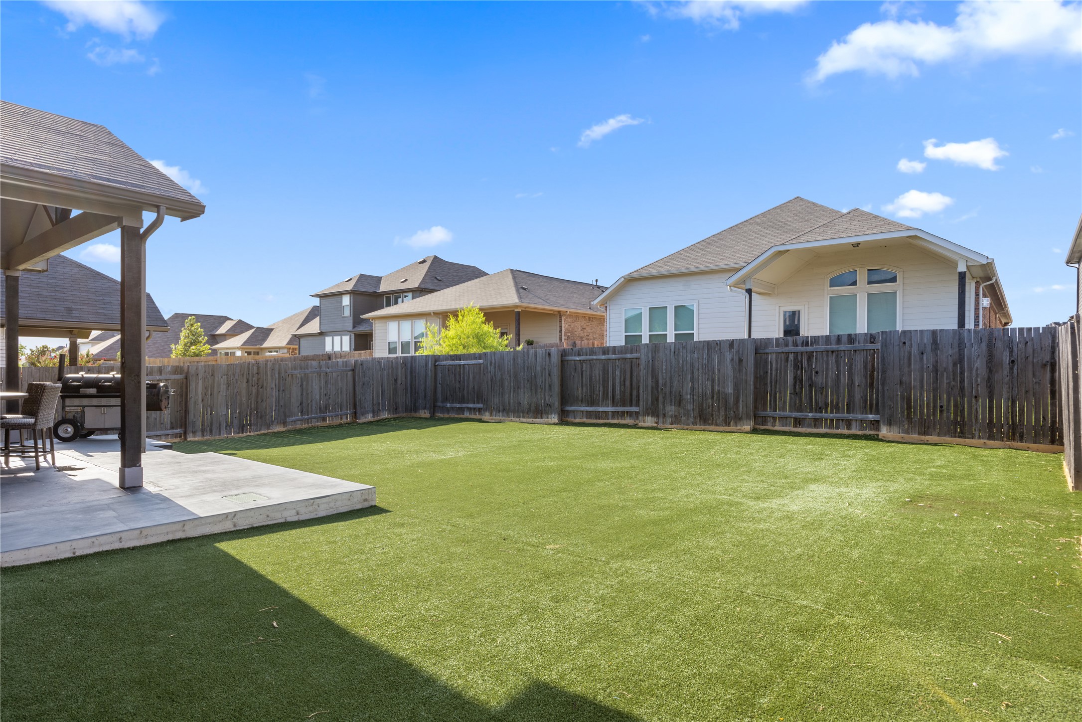 241 Oleander Loop Buda, TX 78610 - Photo 28 of 33 a swimming pool with wooden fence