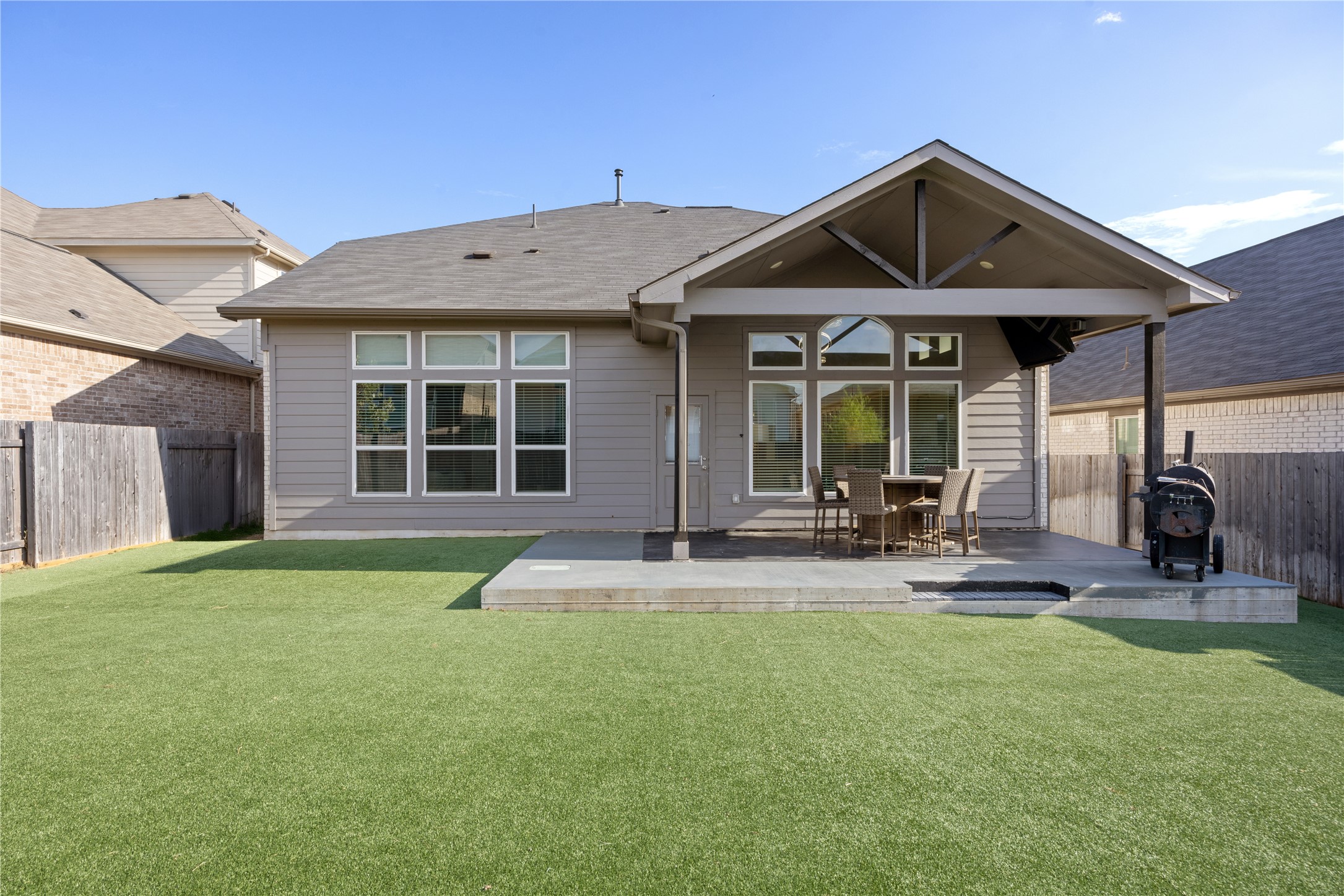 241 Oleander Loop Buda, TX 78610 - Photo 29 of 33 a front view of a house with patio and garden