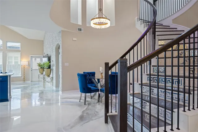a view of entryway and hall with dining room