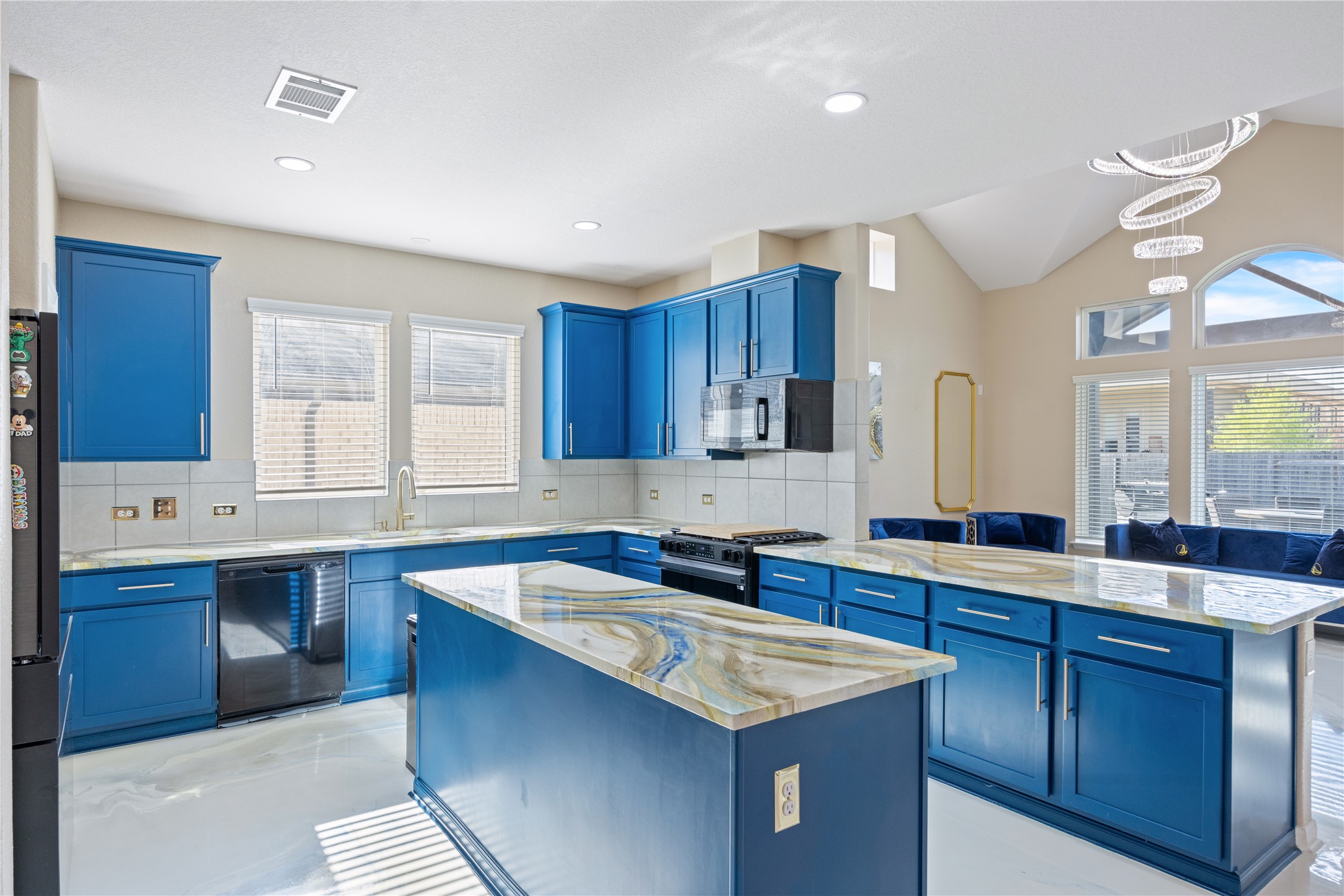 241 Oleander Loop Buda, TX 78610 - Photo 5 of 33 a kitchen with a sink stove and cabinets