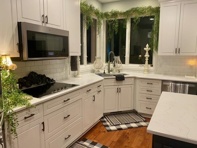 9261 Ruth Court St. John, IN 46373 - Photo 7 of 48 a kitchen with a sink stove and microwave