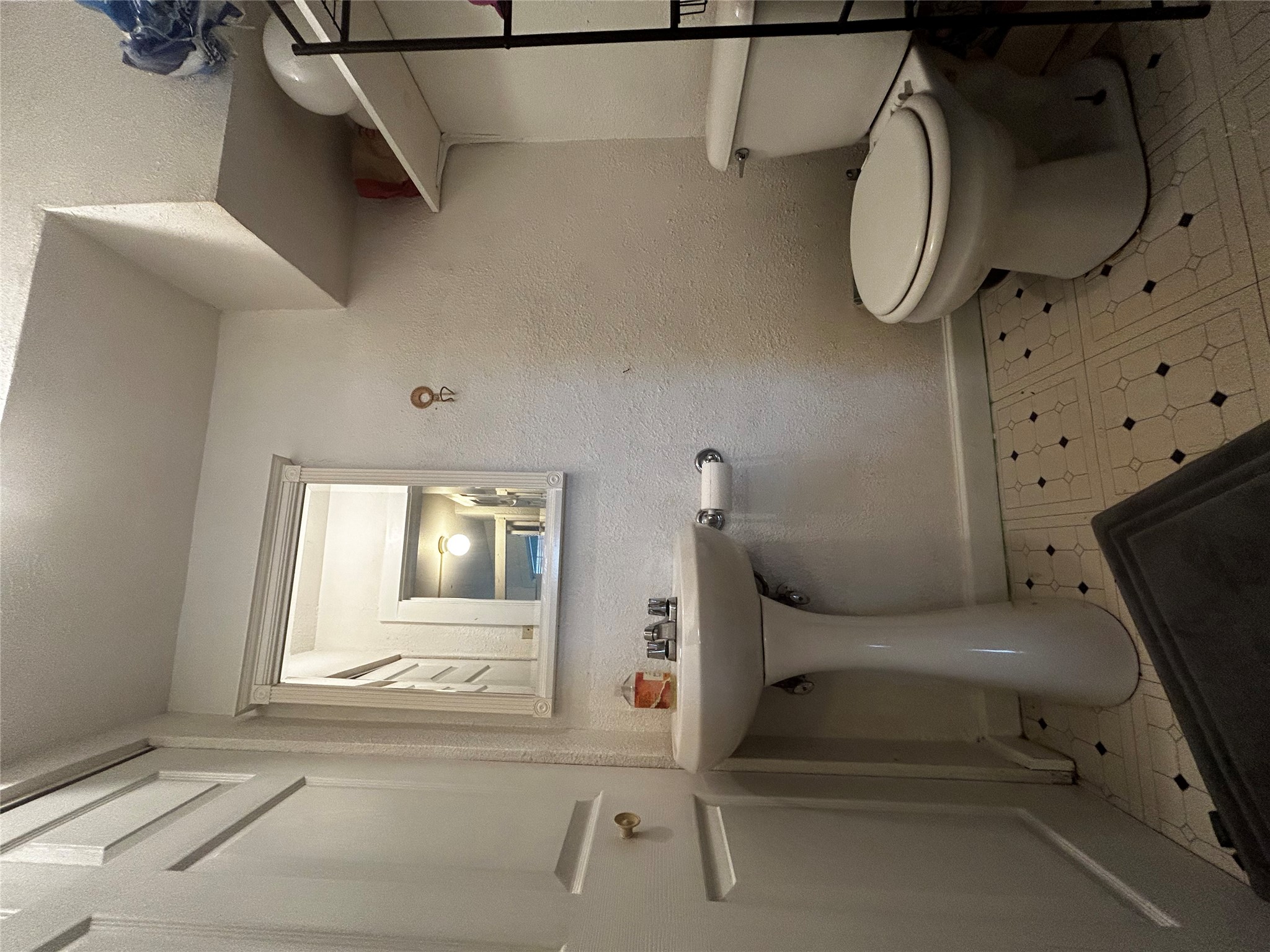 4511 Avenue B, Unit B Austin, TX 78751 - Photo 14 of 15 Half bath with light flooring and a textured wall