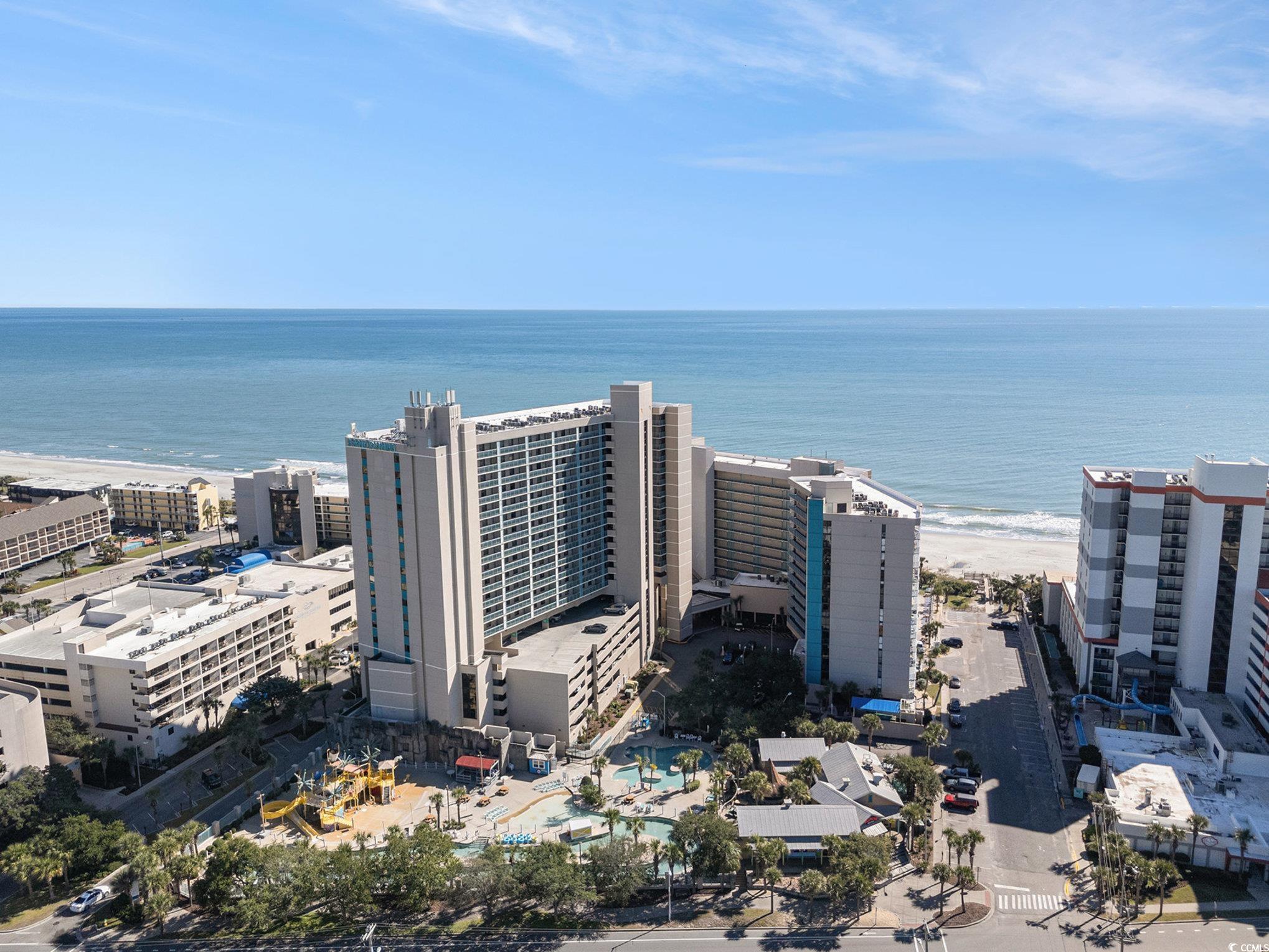 Drone / aerial view of waterfront with a beach