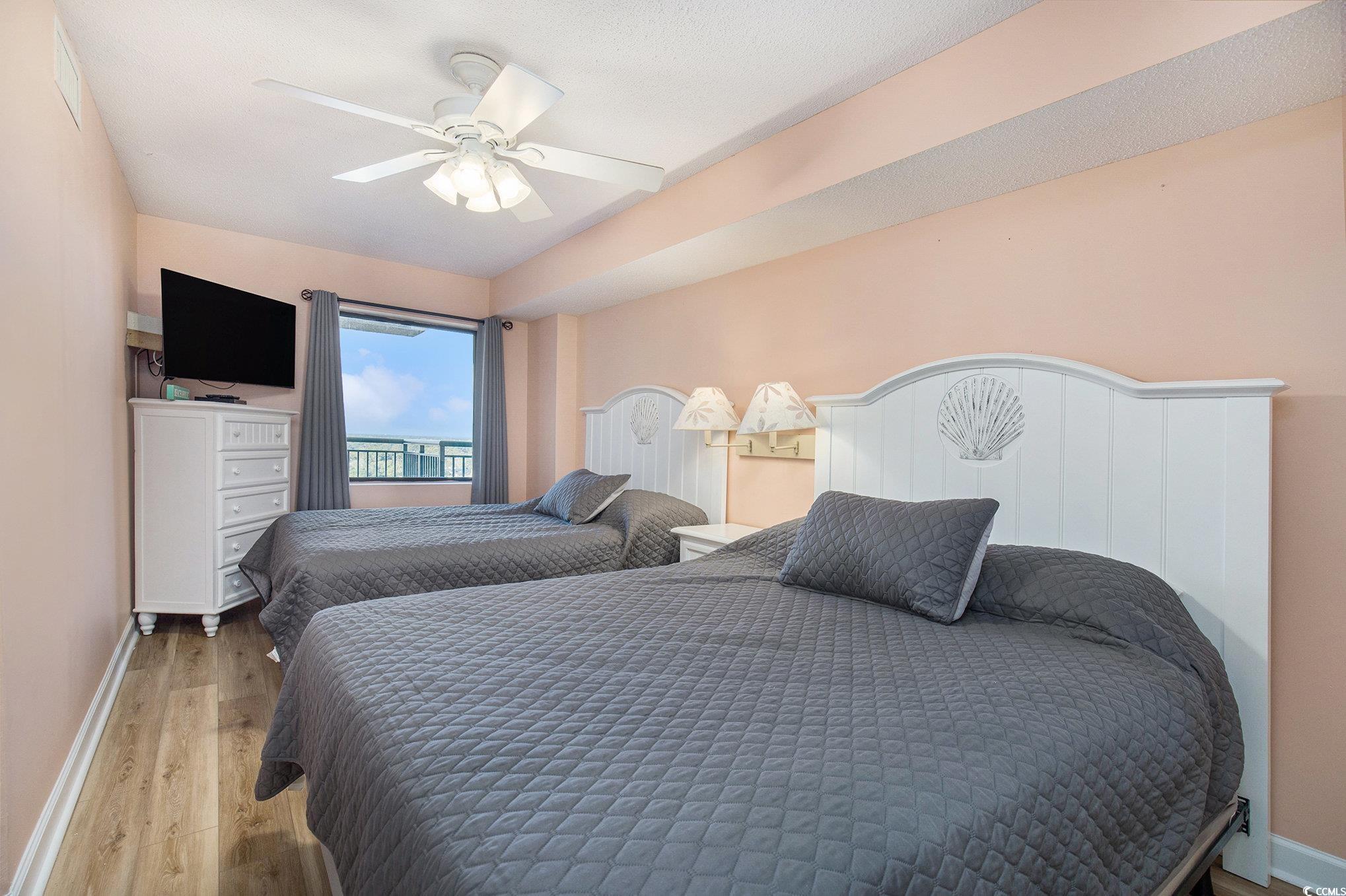 205 74th Avenue North, Unit 1810 Myrtle Beach, SC 29572 - Photo 29 of 37 Bedroom featuring light wood-type flooring and ceiling fan