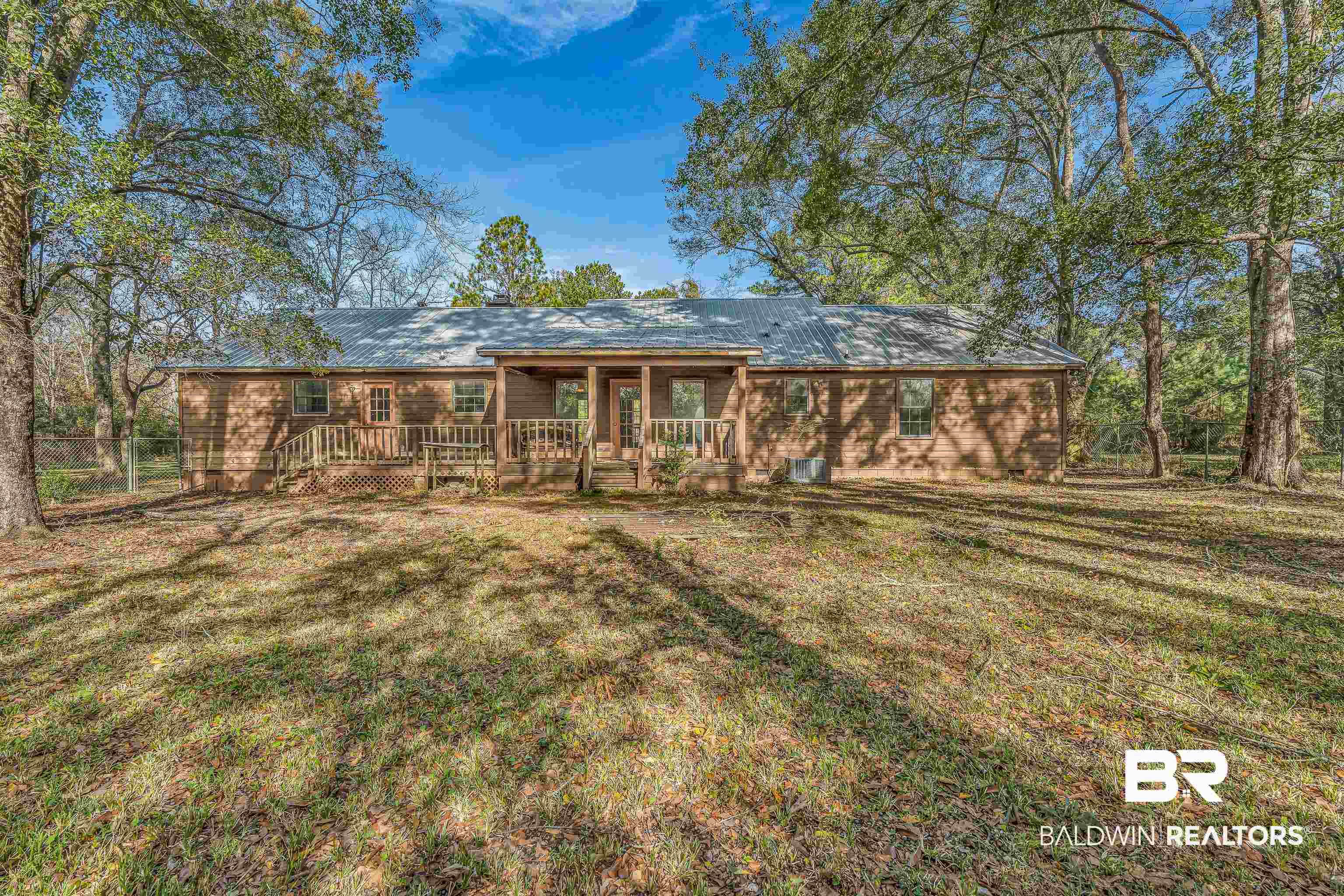 7787 Bellingrath Road Theodore, AL 36582 - Photo 4 of 36 Back of property featuring a wooden deck