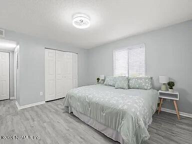 3270 Ricky Drive, Unit 1501 Jacksonville, FL 32223 - Photo 12 of 22 a bedroom with a bed and a table