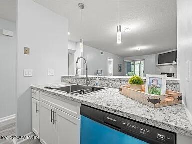 3270 Ricky Drive, Unit 1501 Jacksonville, FL 32223 - Photo 13 of 22 a kitchen with granite countertop a sink a counter top space and appliances