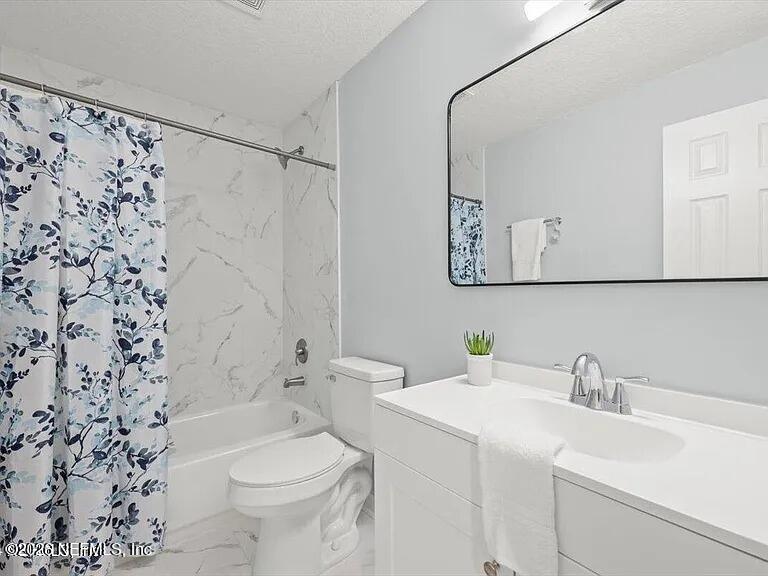 3270 Ricky Drive, Unit 1501 Jacksonville, FL 32223 - Photo 18 of 22 a bathroom with a sink toilet and shower