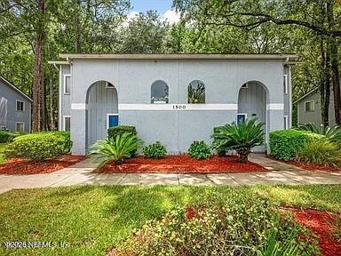3270 Ricky Drive, Unit 1501 Jacksonville, FL 32223 - Photo 21 of 22 a front view of a house with a garden