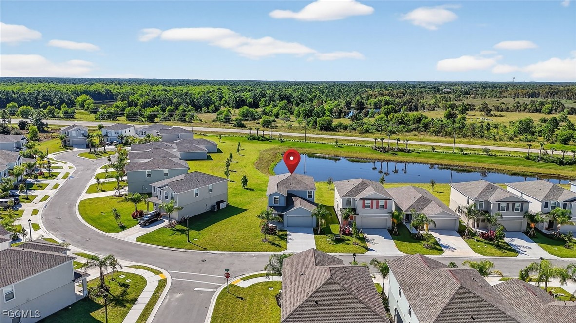 19778 Garden Ridge Lehigh Acres, FL 33936 - Photo 29 of 31 a view of swimming pool with a table and chairs