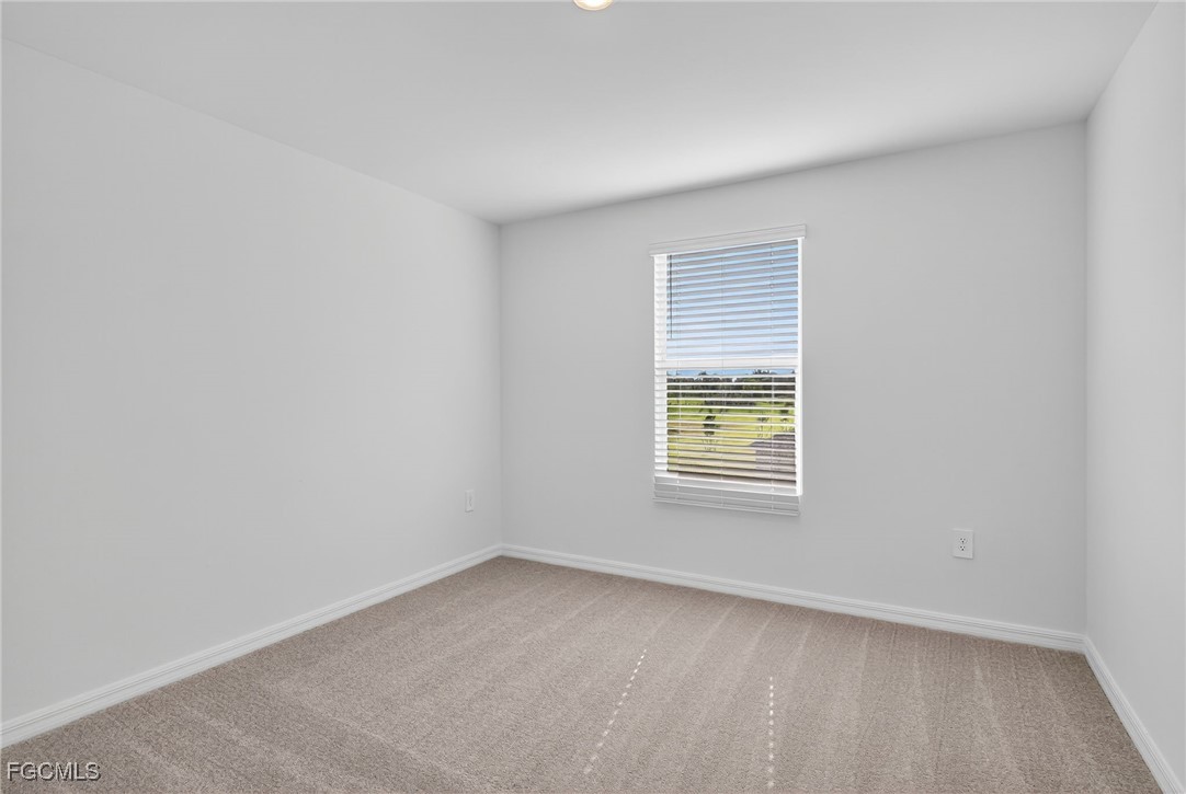 19778 Garden Ridge Lehigh Acres, FL 33936 - Photo 7 of 31 an empty room with a window