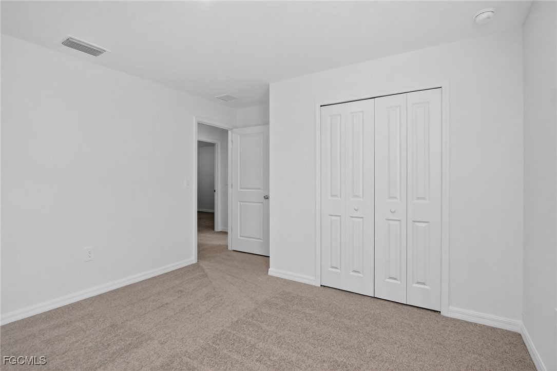 19778 Garden Ridge Lehigh Acres, FL 33936 - Photo 8 of 31 a view of an empty room