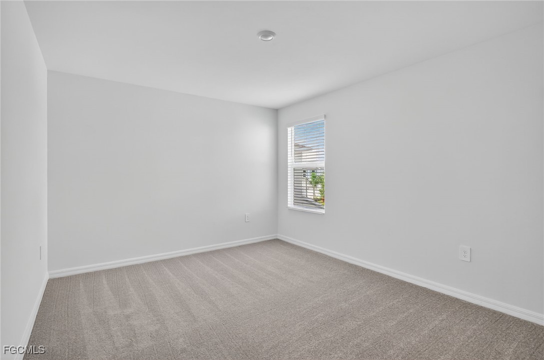 19778 Garden Ridge Lehigh Acres, FL 33936 - Photo 10 of 31 a view of an empty room with a window