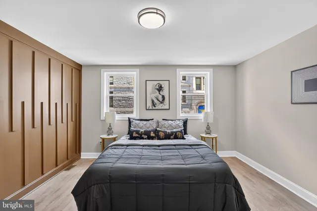 a bedroom with a large bed and a window