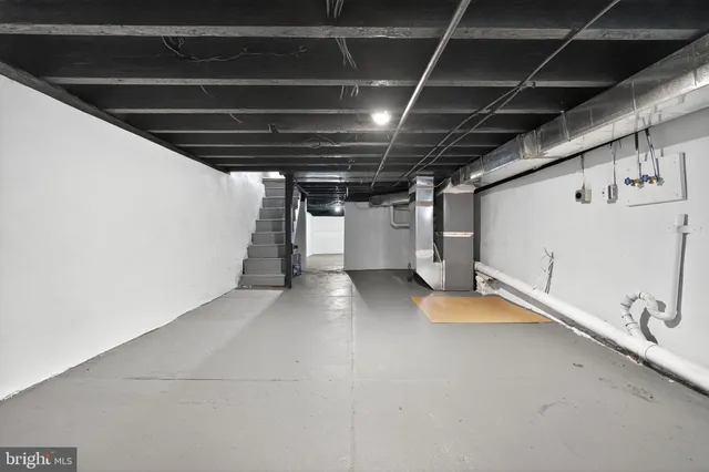 a view of empty room with wooden walls