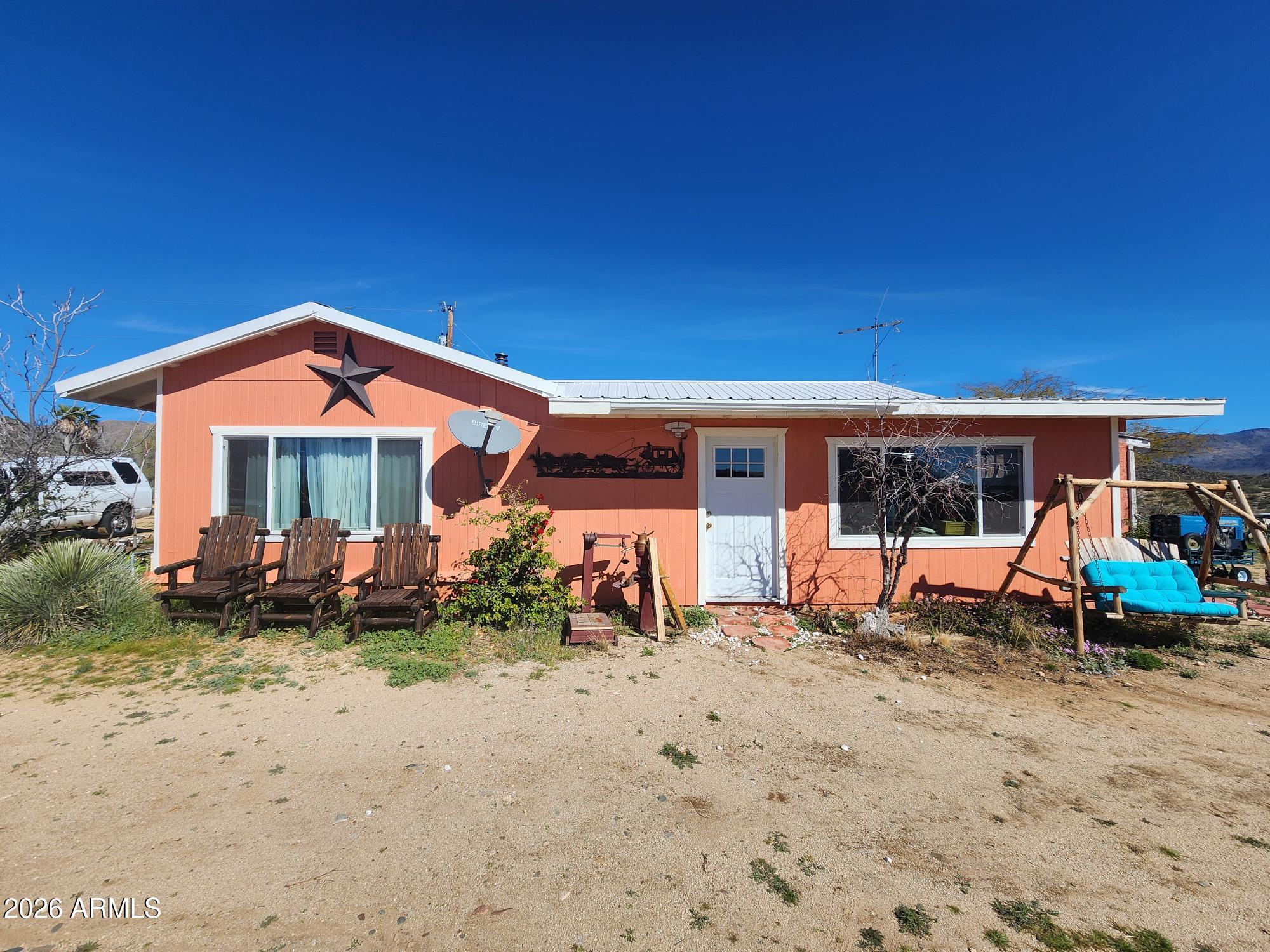 26115 Ghost Town Road Congress, AZ 85332 - Photo 1 of 64 a front view of a house with garden