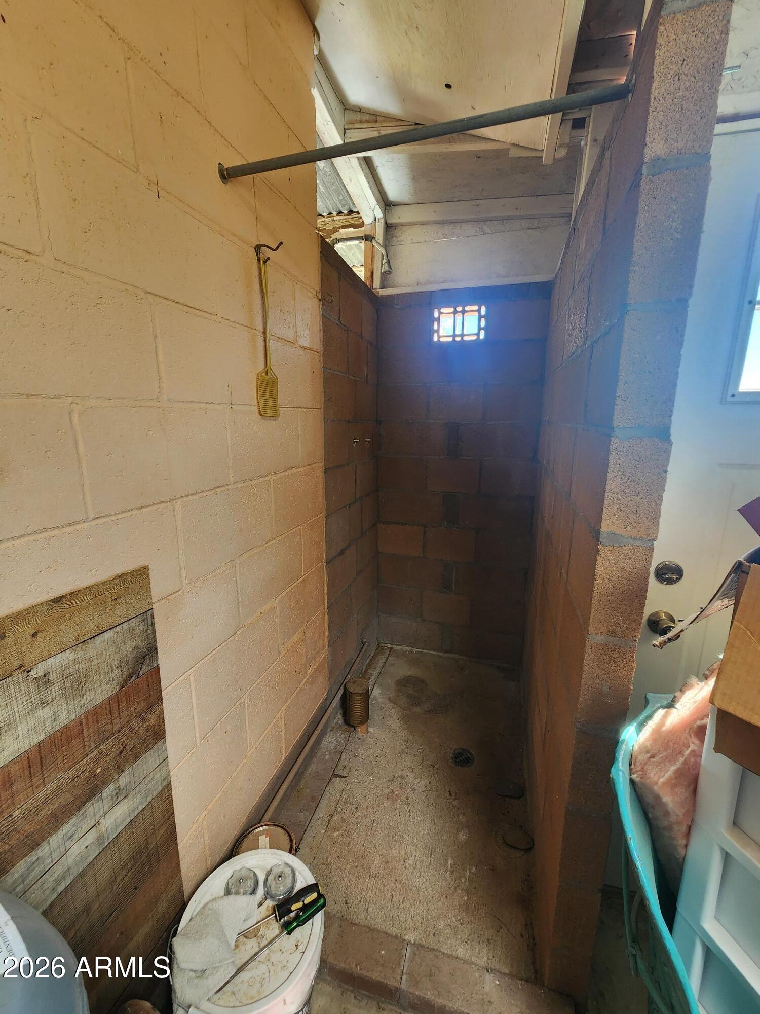 26115 Ghost Town Road Congress, AZ 85332 - Photo 21 of 64 a bathroom with a toilet and a shower