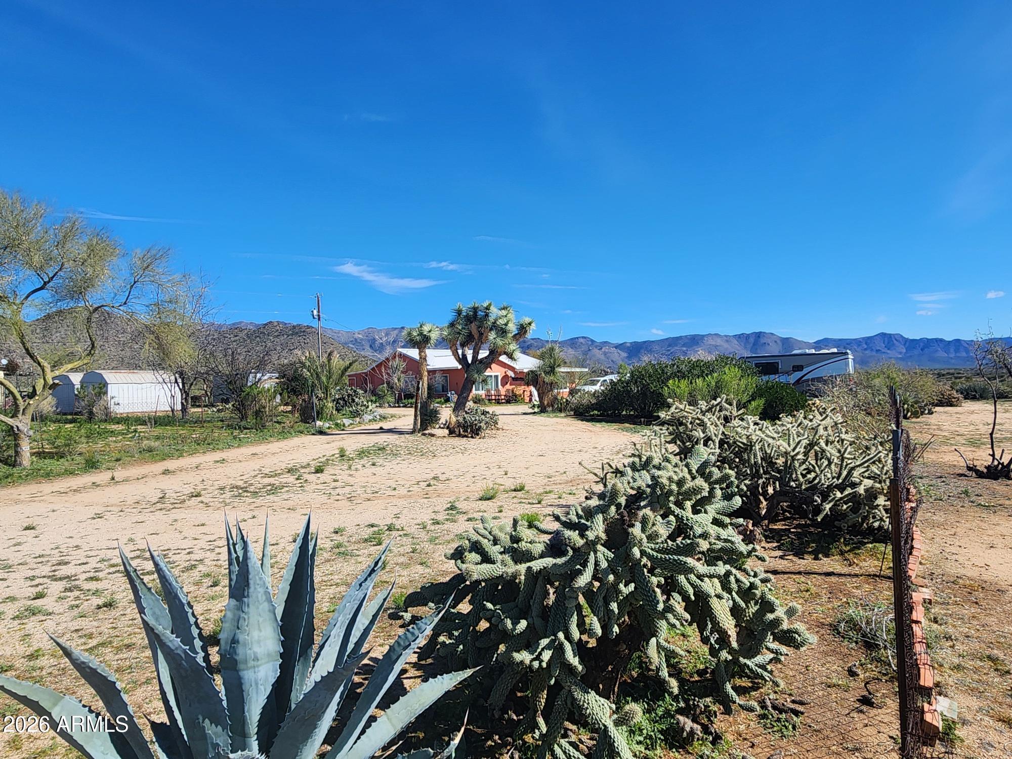 26115 Ghost Town Road Congress, AZ 85332 - Photo 25 of 64 a view of a lake with a mountain in the background