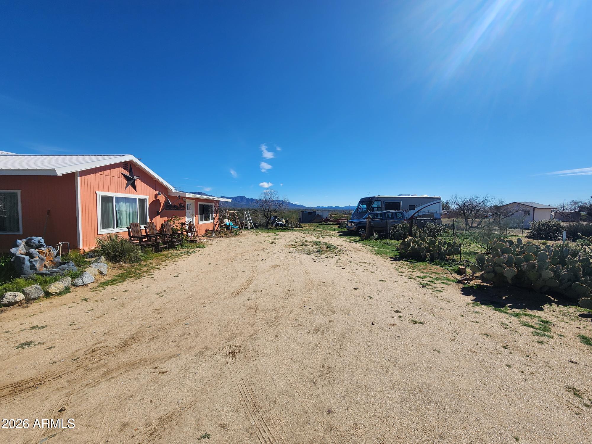 26115 Ghost Town Road Congress, AZ 85332 - Photo 32 of 64 a view of a dirt road and building