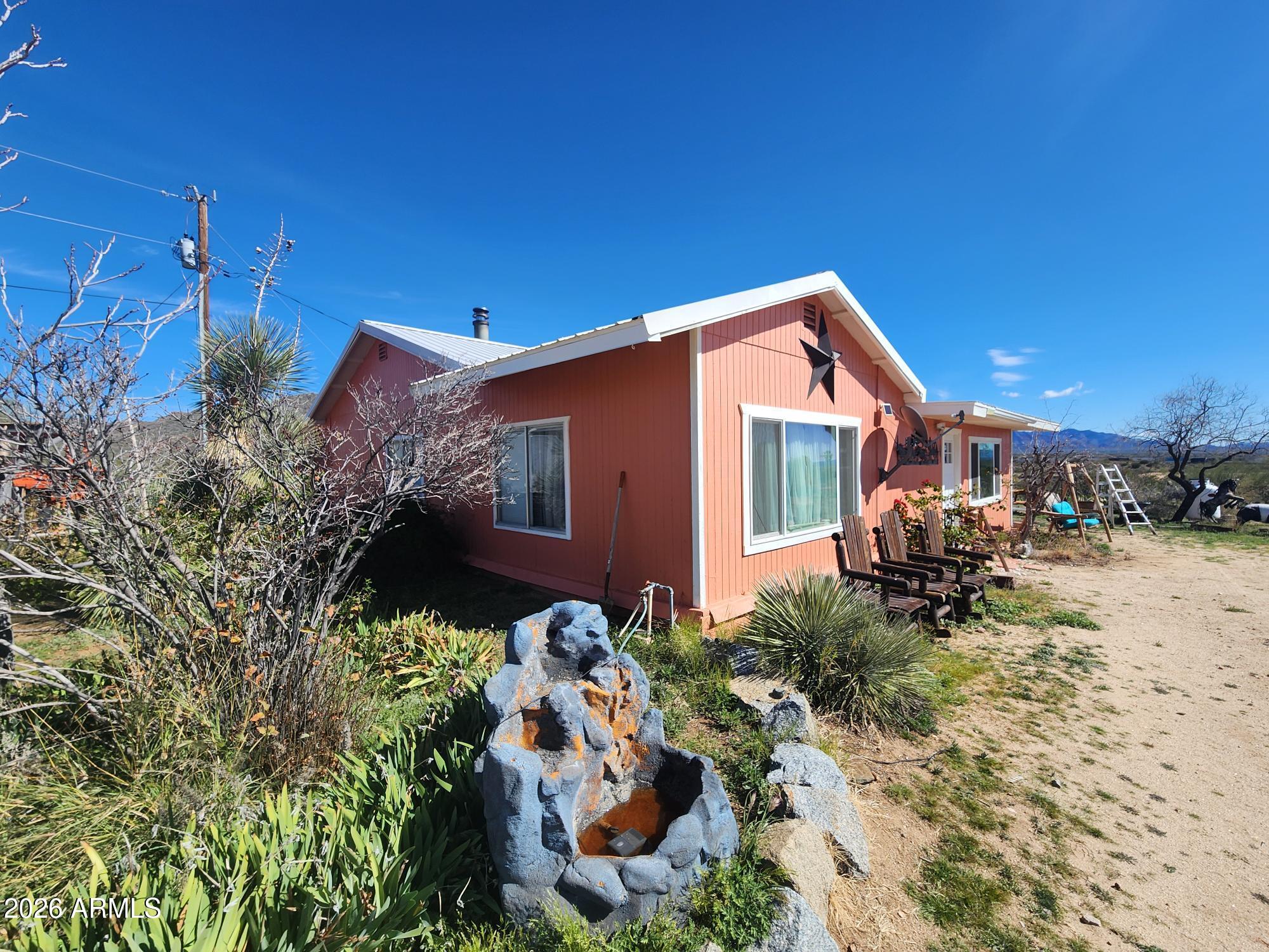 26115 Ghost Town Road Congress, AZ 85332 - Photo 33 of 64 a front view of a house with a yard
