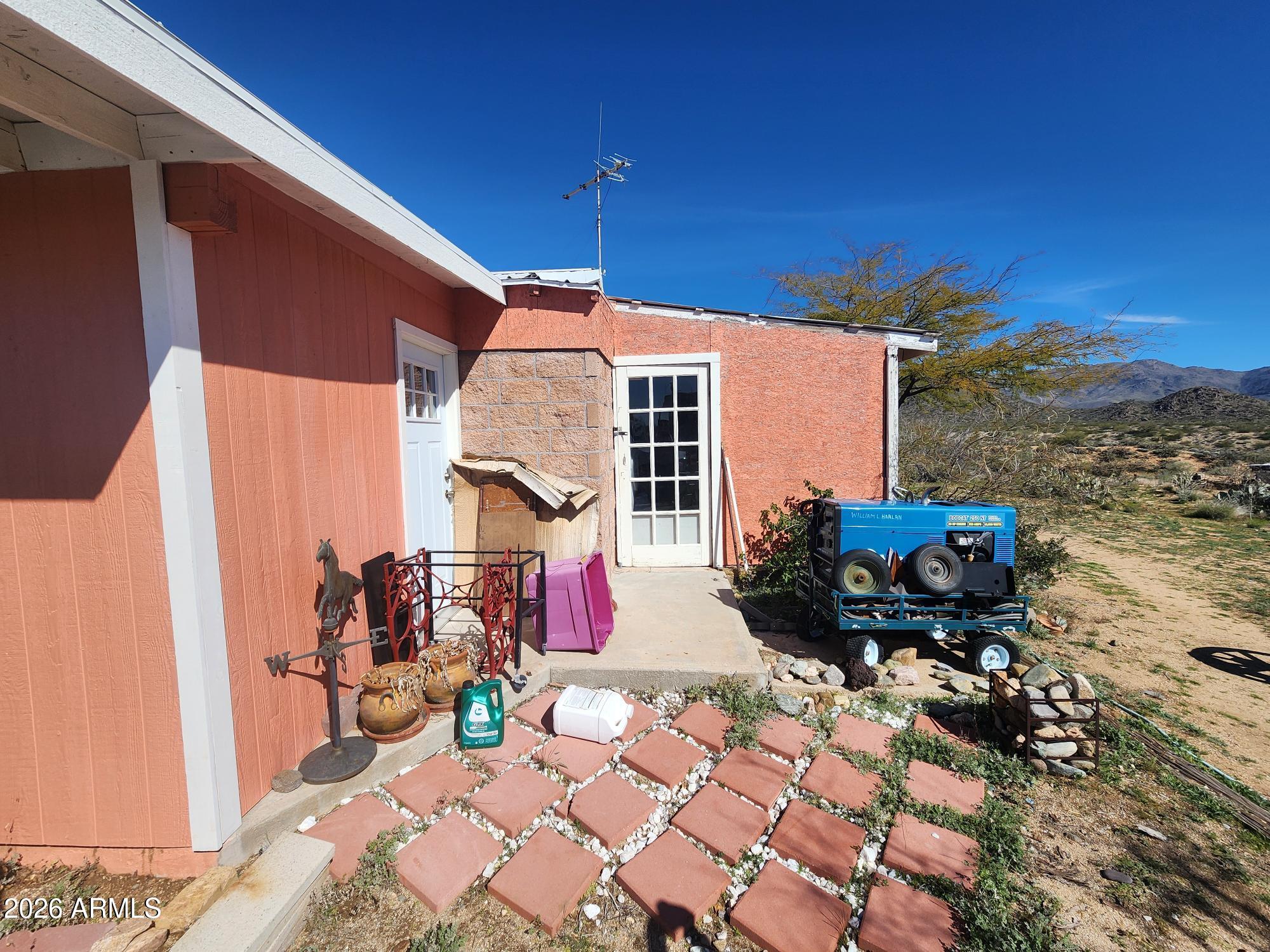 26115 Ghost Town Road Congress, AZ 85332 - Photo 37 of 64 a front view of a house with patio