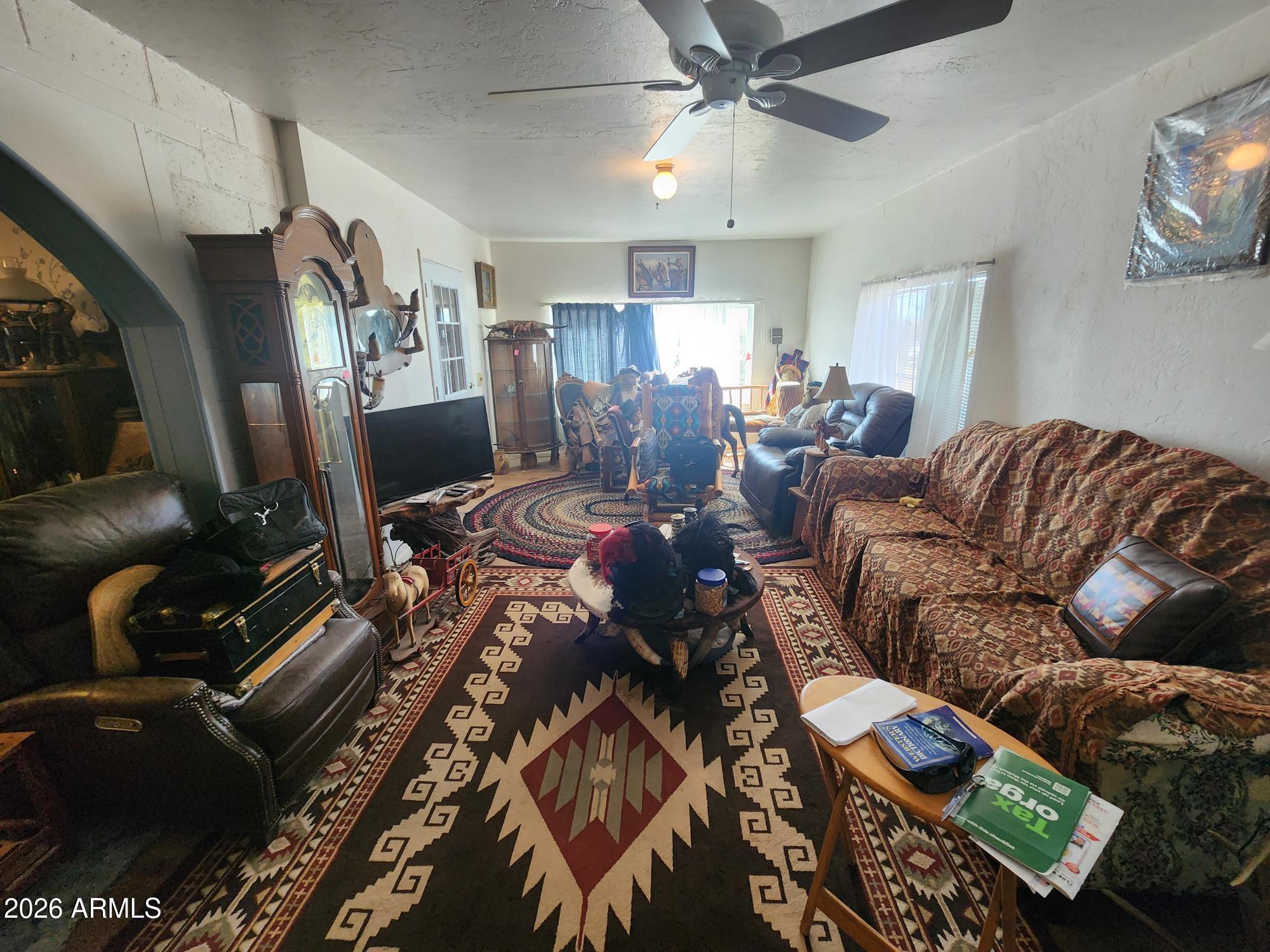 26115 Ghost Town Road Congress, AZ 85332 - Photo 4 of 64 a living room with furniture and a flat screen tv