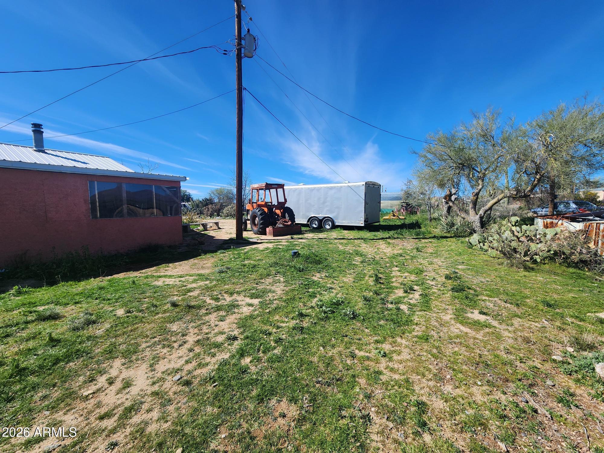26115 Ghost Town Road Congress, AZ 85332 - Photo 42 of 64 a view of a backyard with plants and a patio