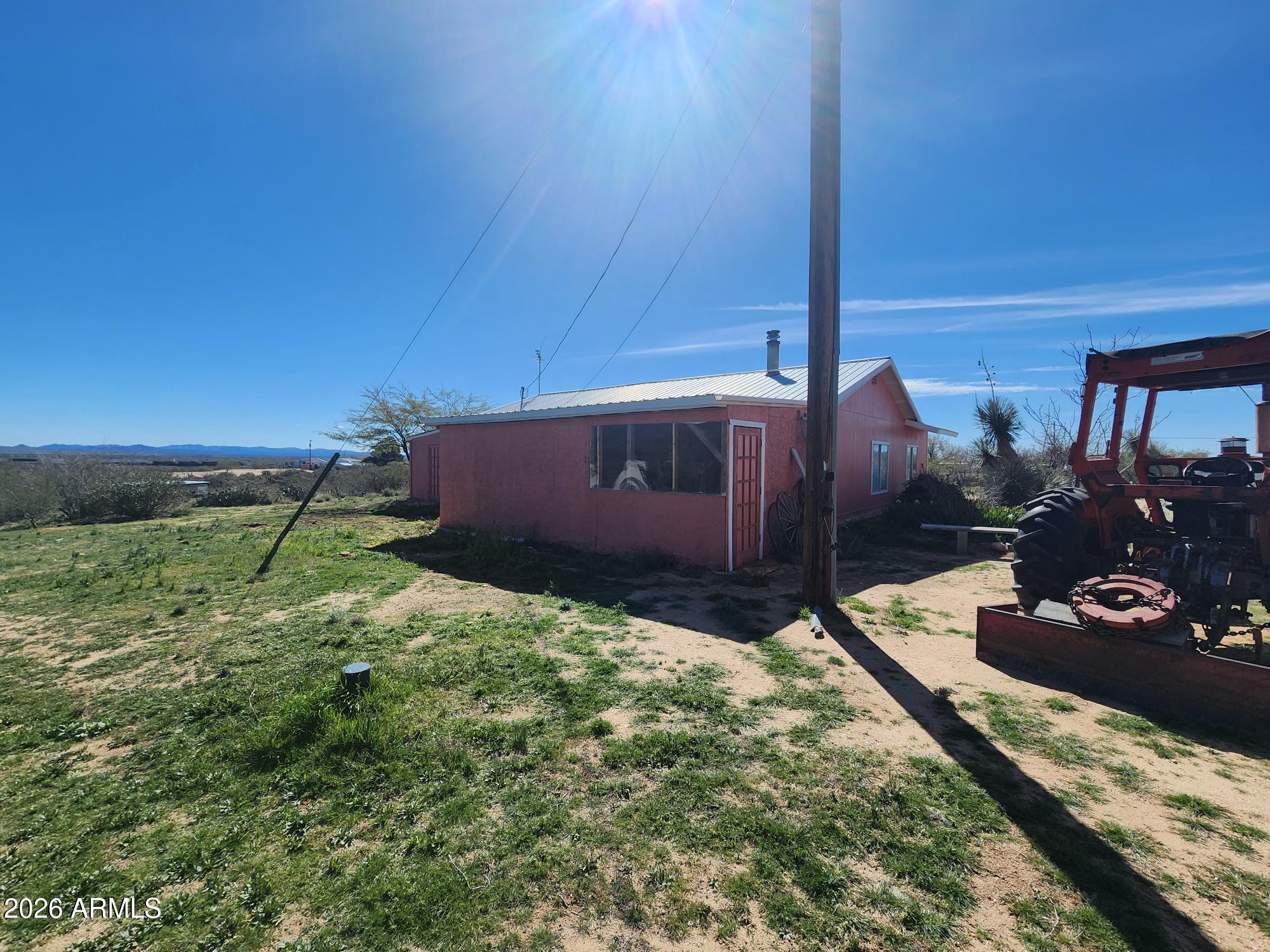 26115 Ghost Town Road Congress, AZ 85332 - Photo 43 of 64 a backyard of a house with lots of green space