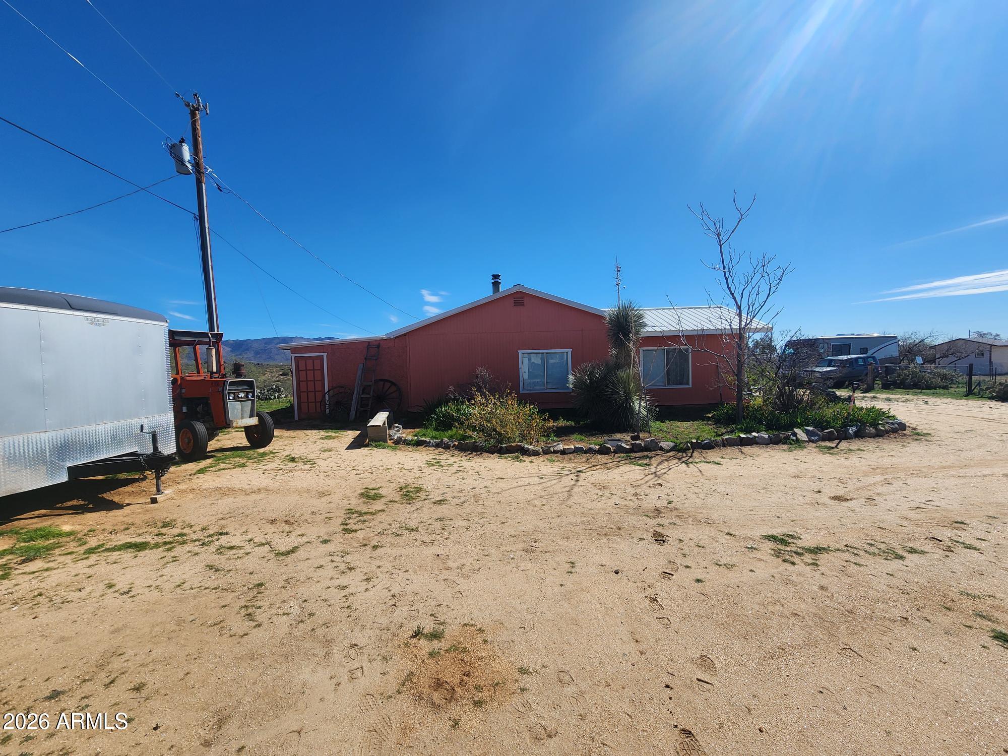 26115 Ghost Town Road Congress, AZ 85332 - Photo 45 of 64 a view of a house with a yard