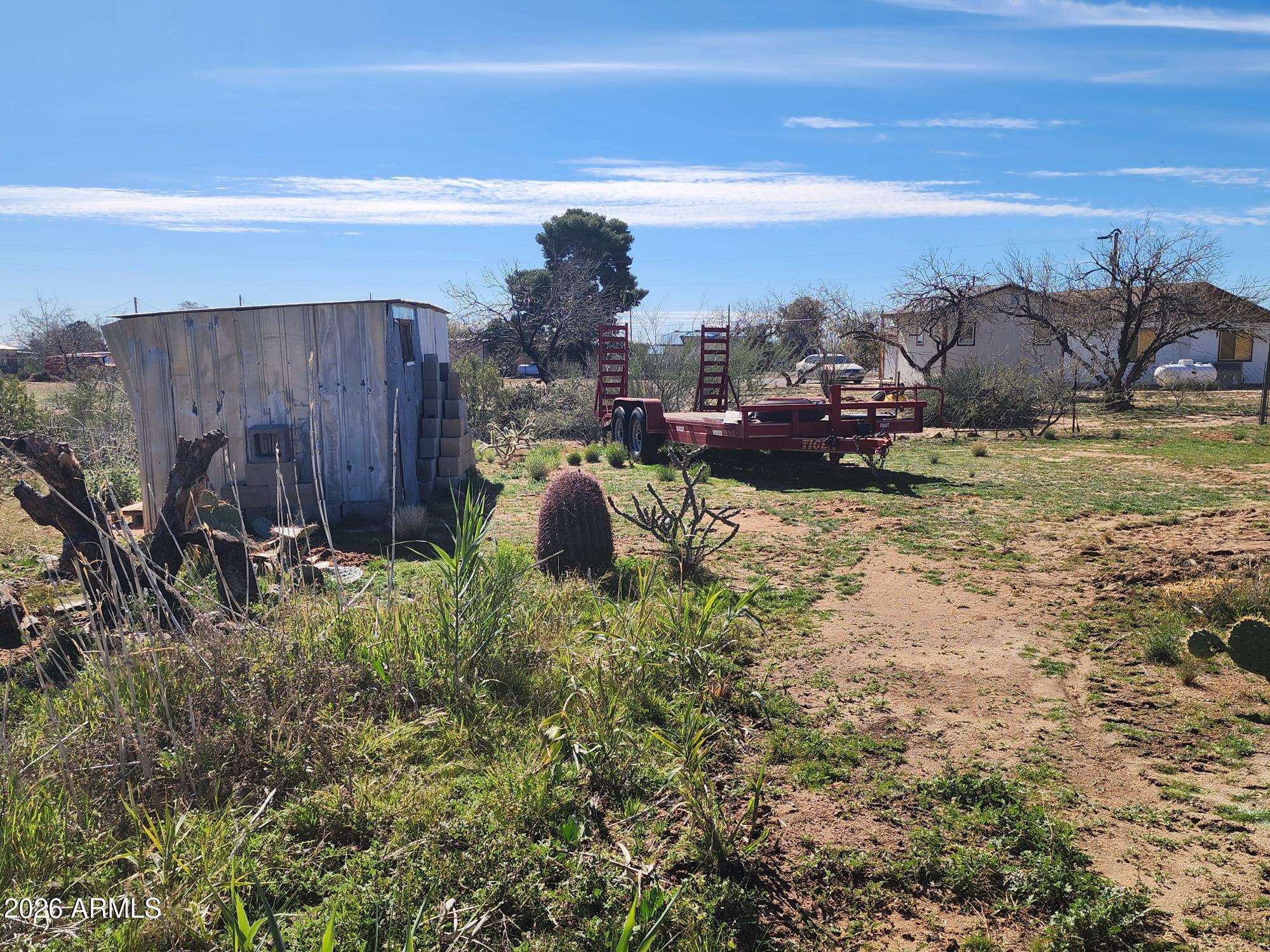 26115 Ghost Town Road Congress, AZ 85332 - Photo 51 of 64 a view of a backyard with plants and lake view