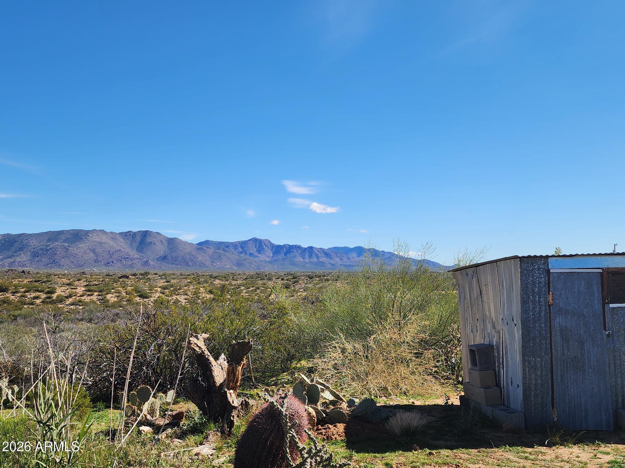 26115 Ghost Town Road Congress, AZ 85332 - Photo 52 of 64 a view of a lake with a mountain in the background
