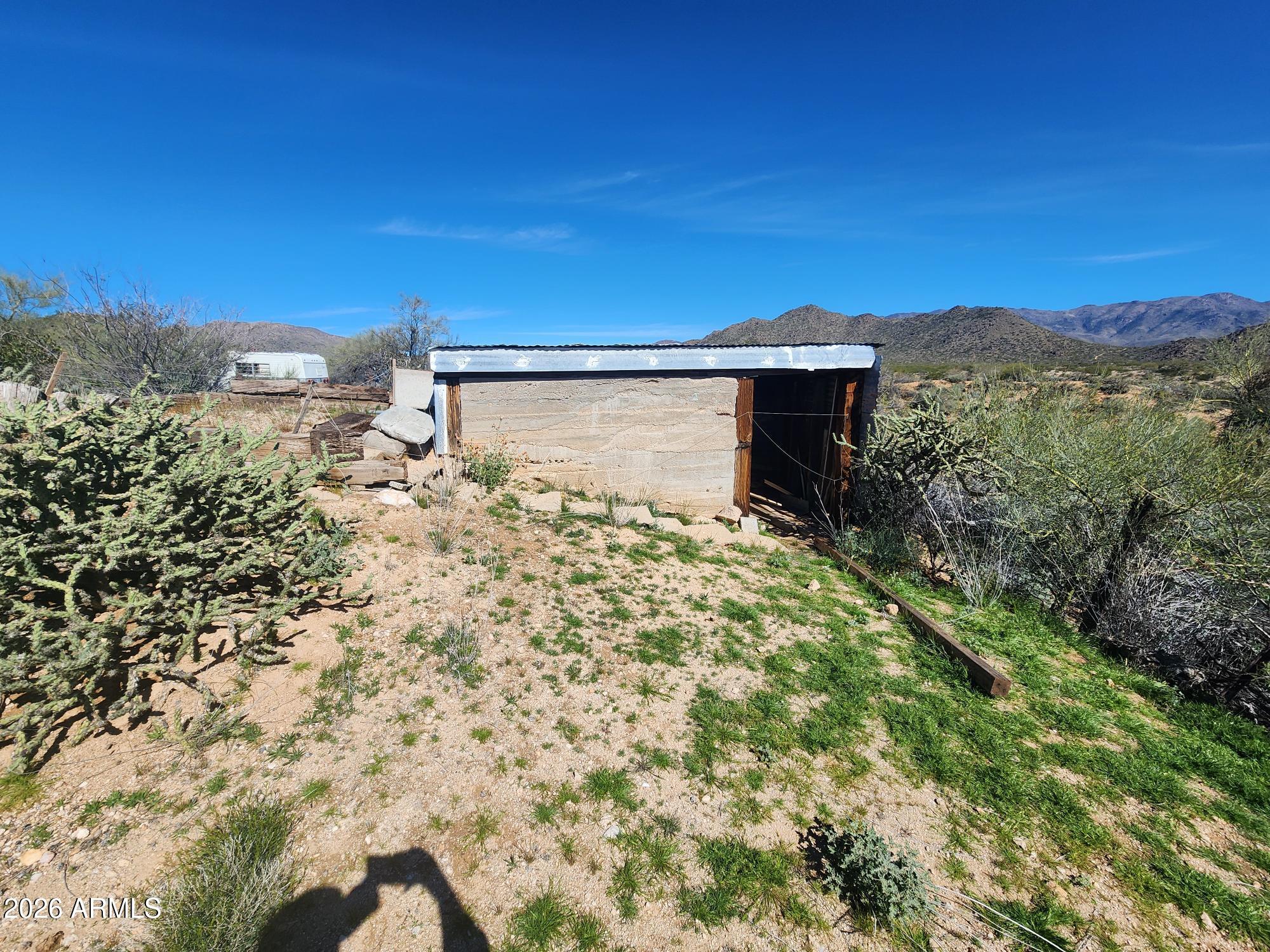 26115 Ghost Town Road Congress, AZ 85332 - Photo 56 of 64 a view of a house with a yard