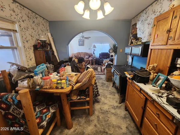 a kitchen with a sink appliances and cabinets