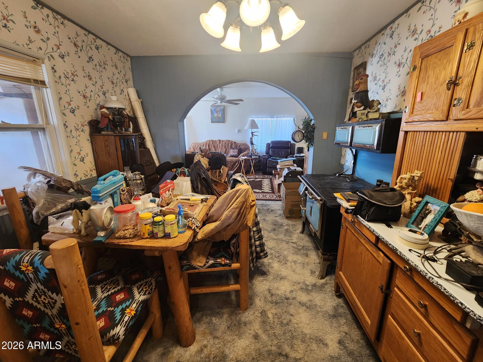 26115 Ghost Town Road Congress, AZ 85332 - Photo 6 of 64 a living room with furniture a fireplace and a flat screen tv