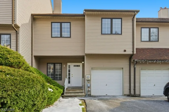a front view of a house with a garage