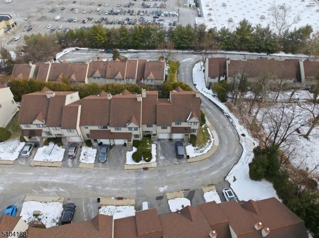 an aerial view of houses with outdoor space