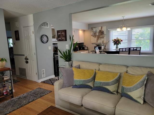 225 Hemlock Avenue Romeoville, IL 60446 - Photo 11 of 32 a living room with furniture and wooden floor