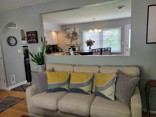 225 Hemlock Avenue Romeoville, IL 60446 - Photo 12 of 32 a living room with furniture and a mirror