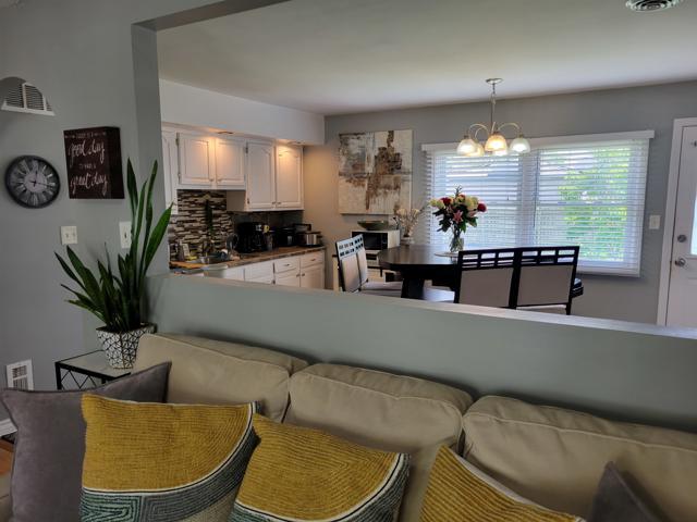 225 Hemlock Avenue Romeoville, IL 60446 - Photo 13 of 32 a living room with furniture and a large window