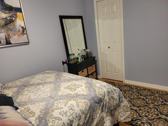 225 Hemlock Avenue Romeoville, IL 60446 - Photo 23 of 32 a bedroom with a bed and wooden floor