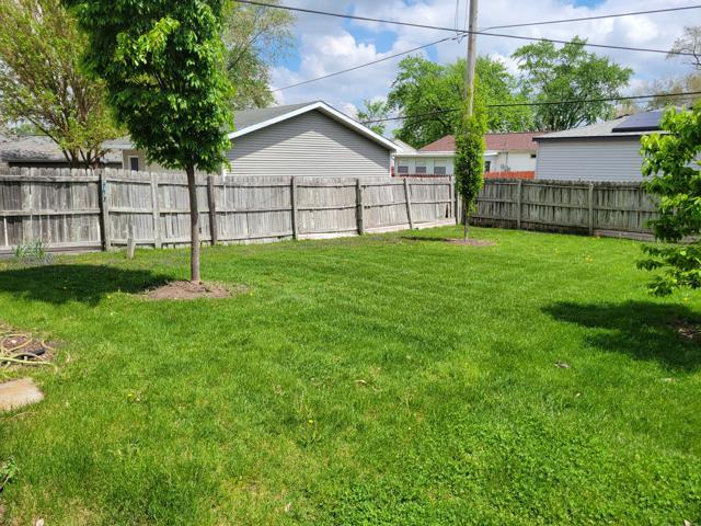 225 Hemlock Avenue Romeoville, IL 60446 - Photo 29 of 32 a view of a backyard with a garden and plants