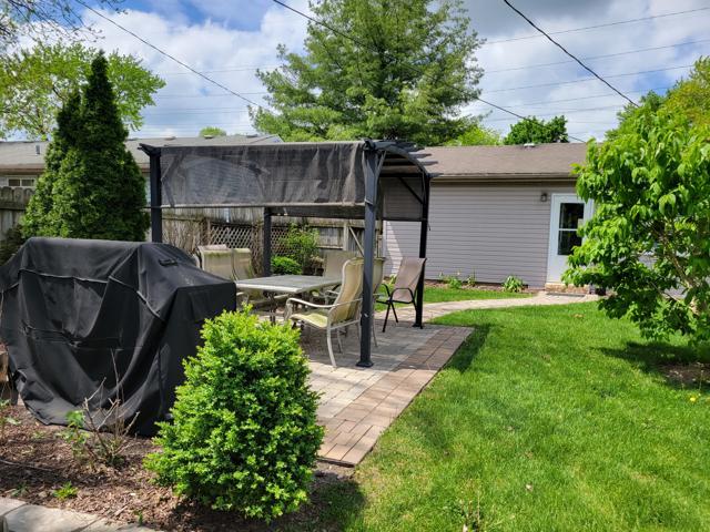 225 Hemlock Avenue Romeoville, IL 60446 - Photo 32 of 32 a view of a chair and table in backyard