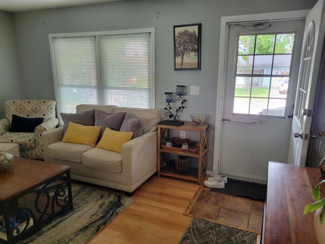 225 Hemlock Avenue Romeoville, IL 60446 - Photo 8 of 32 a living room with furniture and a window