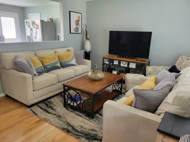 225 Hemlock Avenue Romeoville, IL 60446 - Photo 9 of 32 a living room with furniture and a flat screen tv