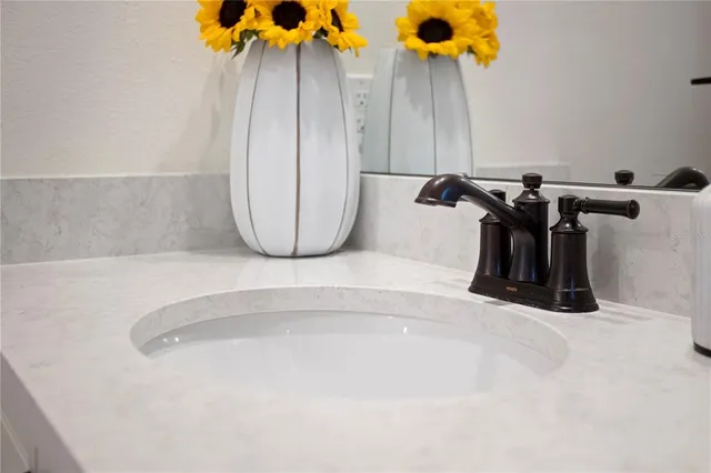 a kitchen with stainless steel appliances white cabinets and a stove top oven