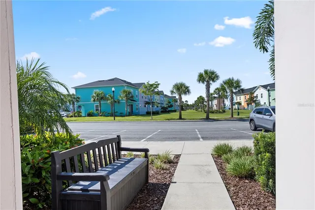 a view of a wooden deck with furniture