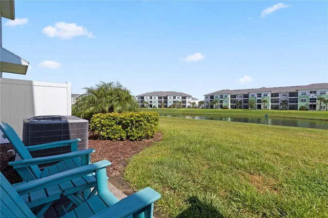 an aerial view of a house with pool yard and outdoor seating