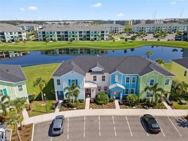 an aerial view of a house with a swimming pool yard and outdoor seating
