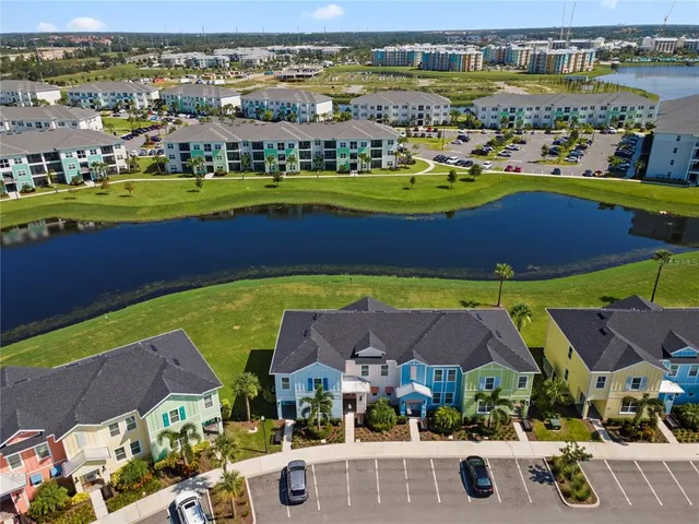 an aerial view of residential houses with outdoor space